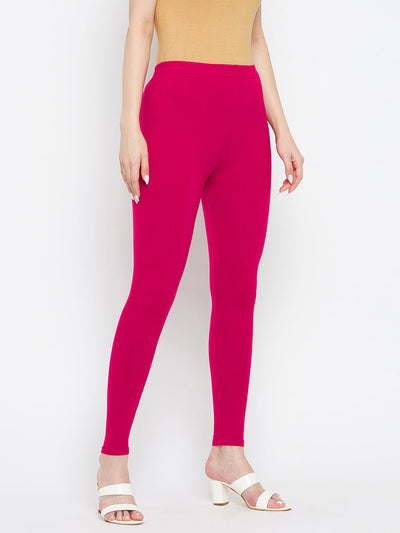 Magenta solid ankle length leggings made from cotton lycra fabric.