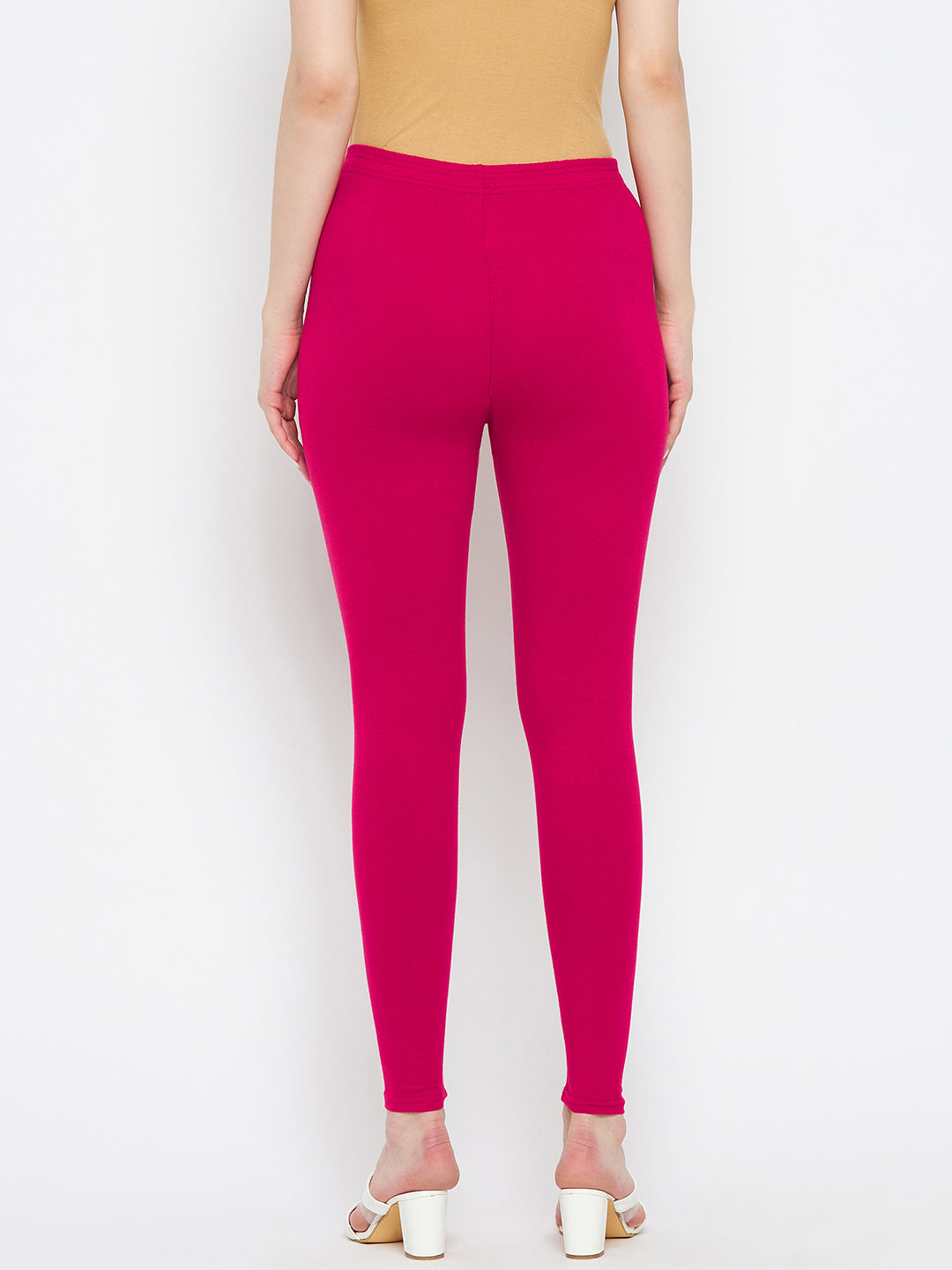 Magenta solid ankle length leggings in cotton lycra fabric.