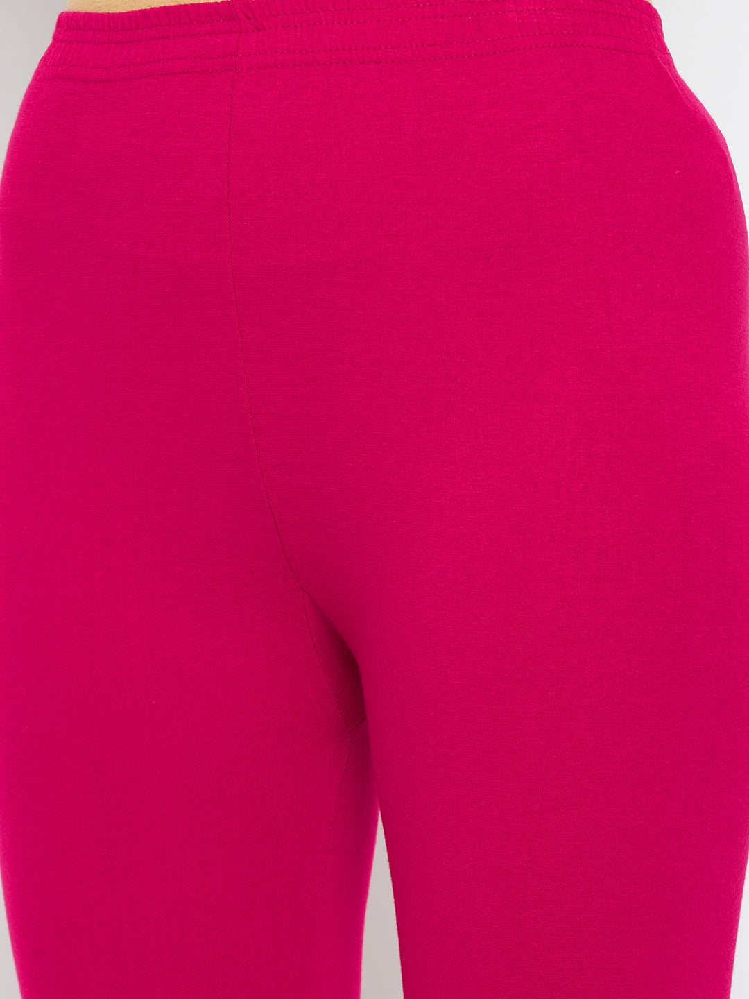 Magenta solid ankle length leggings made from cotton lycra fabric.