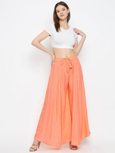Peach solid rayon sharara with elastic waist, lightweight and comfortable for summer wear.