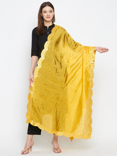 Yellow embellished silk dupatta, elegantly draped, showcasing intricate design.