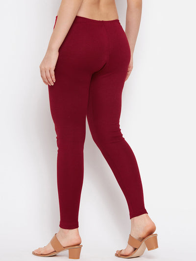 Maroon solid woolen leggings for women, full-length, side view.