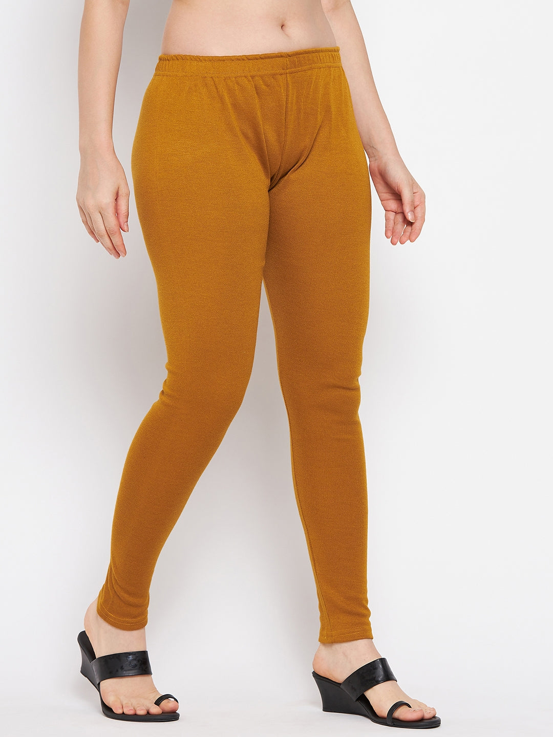 Mustard solid woolen leggings for women, comfortable and stylish.