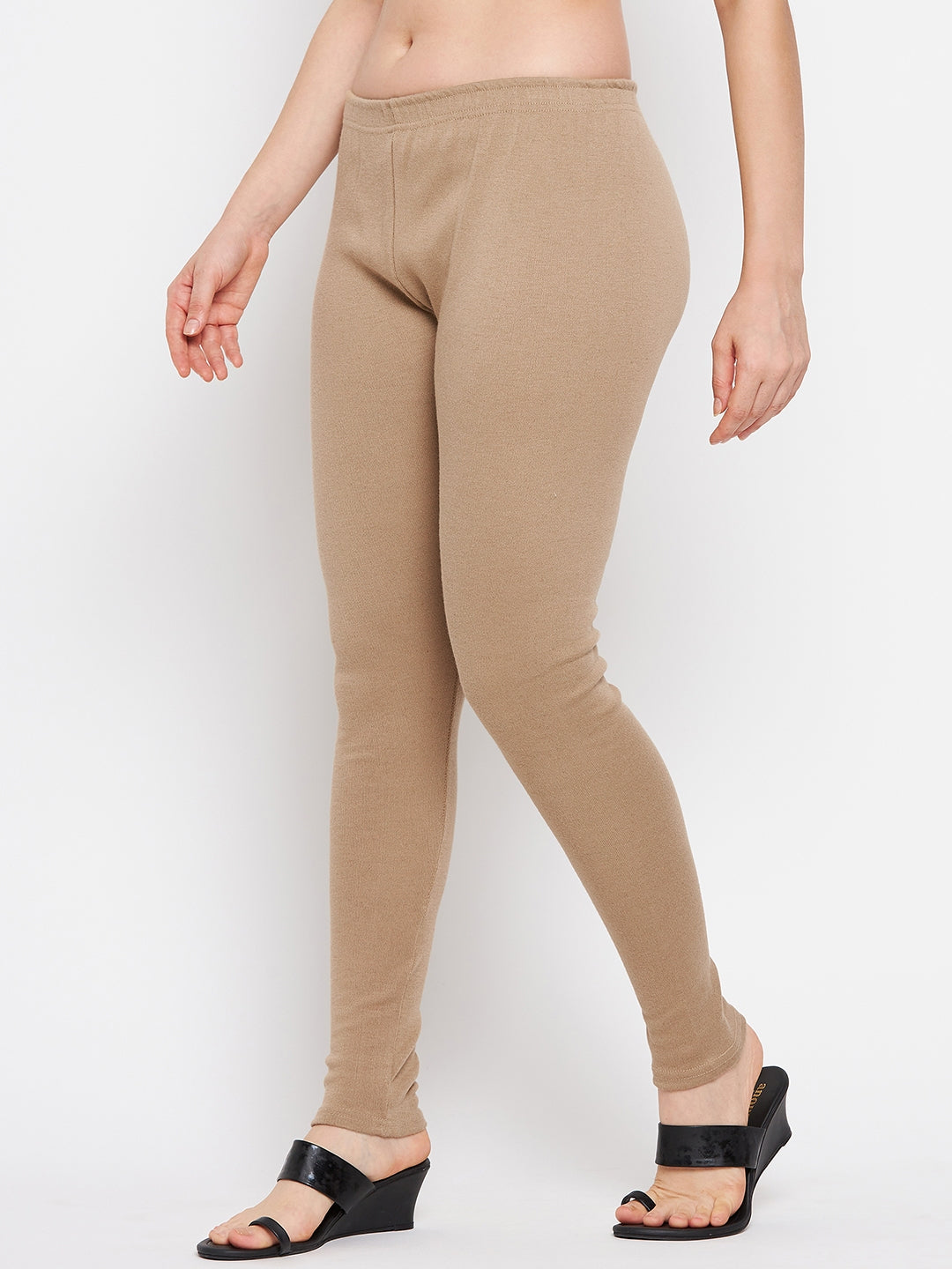 Dark fawn solid woolen leggings worn by a model.