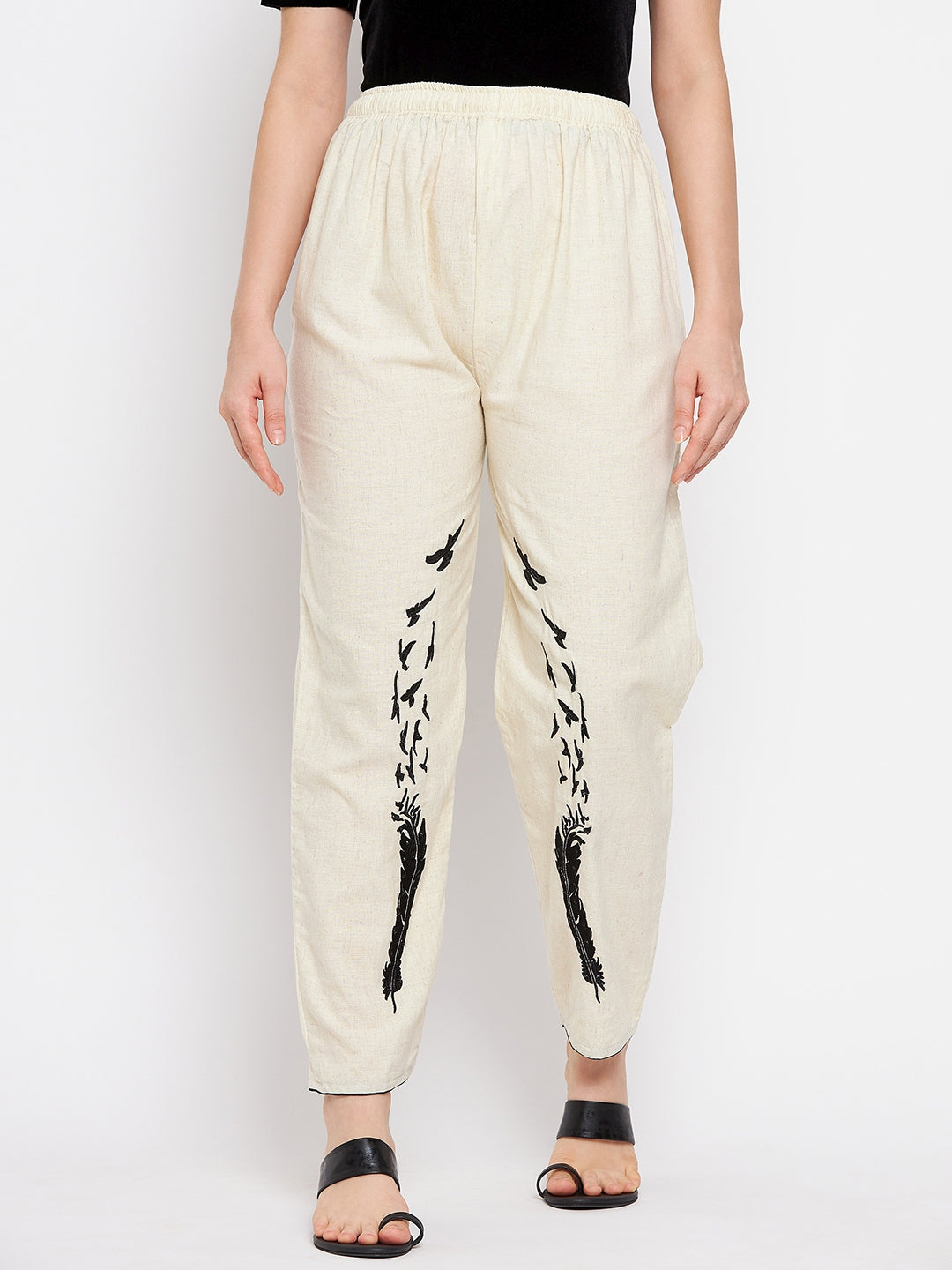 Beige embroidered trouser with elasticated waistband for a comfortable fit.