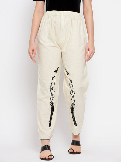 Beige embroidered trouser with elasticated waistband for a comfortable fit.