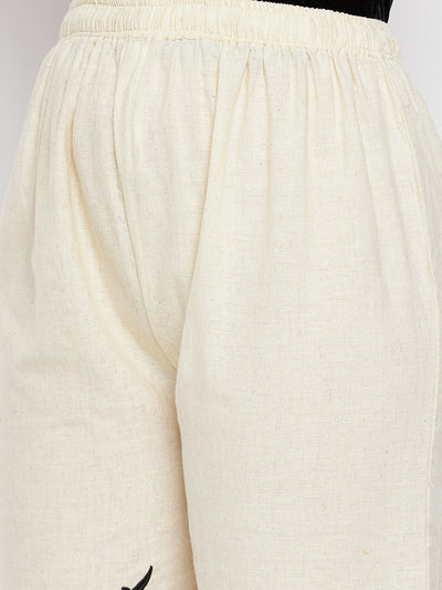 Beige embroidered trouser with elastic waistband and cotton fabric.