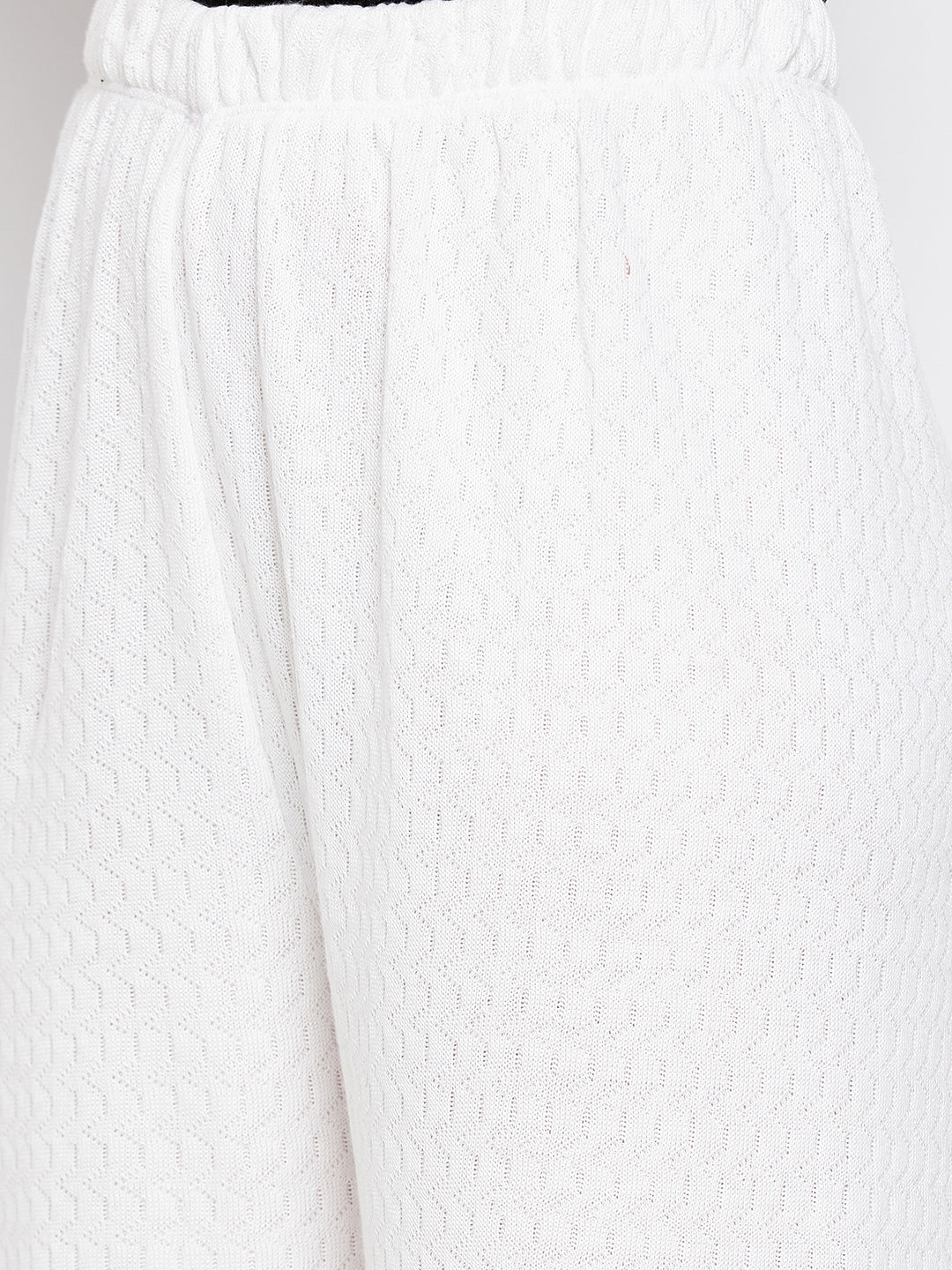 White solid woolen palazzo with textured knit pattern.