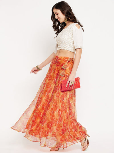 Orange floral printed organza skirt with flared hem and lining.