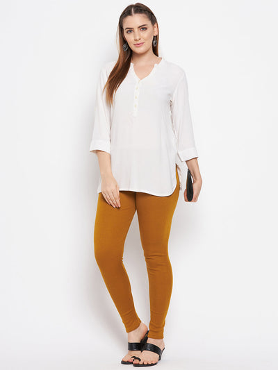 Black & mustard solid woolen leggings pack displayed with a stylish white kurta.