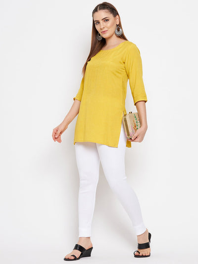 Red and white solid woolen leggings pack, featuring premium quality fabric for comfort, styled with a kurta and heels.