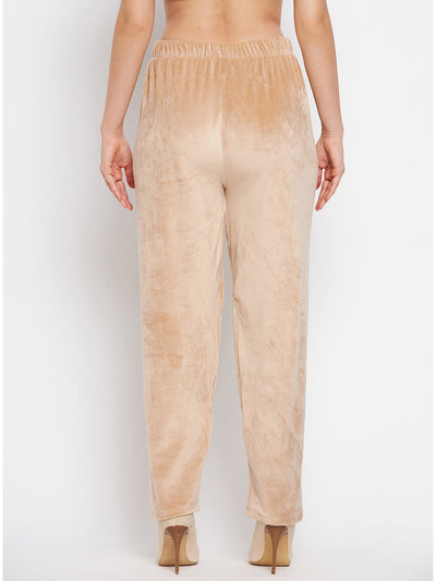 Beige velvet palazzo trousers for women, back view.