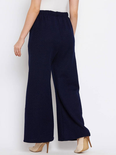 Navy blue woolen palazzo pants from Clora, paired with heels.