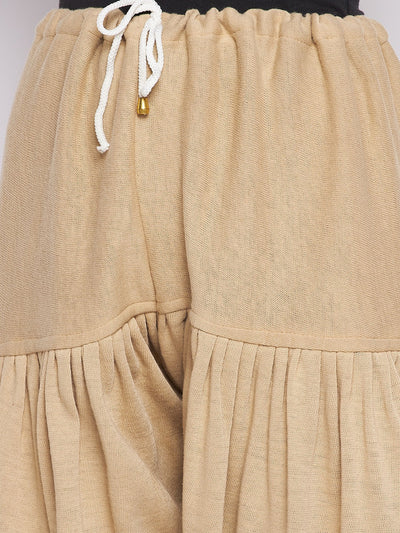 Fawn solid woolen salwar with drawstring waist detail, showcasing pleated design.