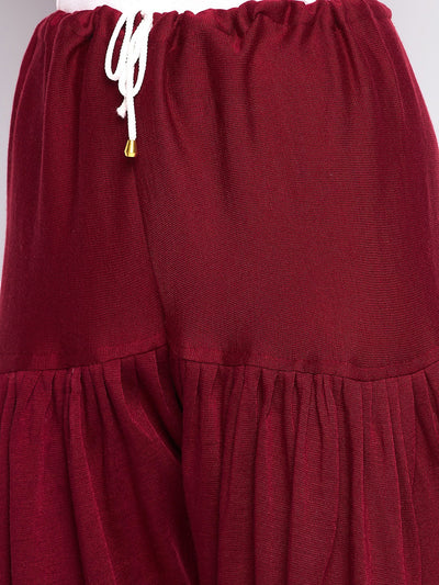 Maroon solid woolen salwar with elastic waistband.