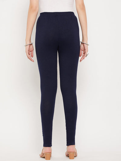 Red and navy blue solid woolen leggings pack displayed on a model, showcasing comfort and style.