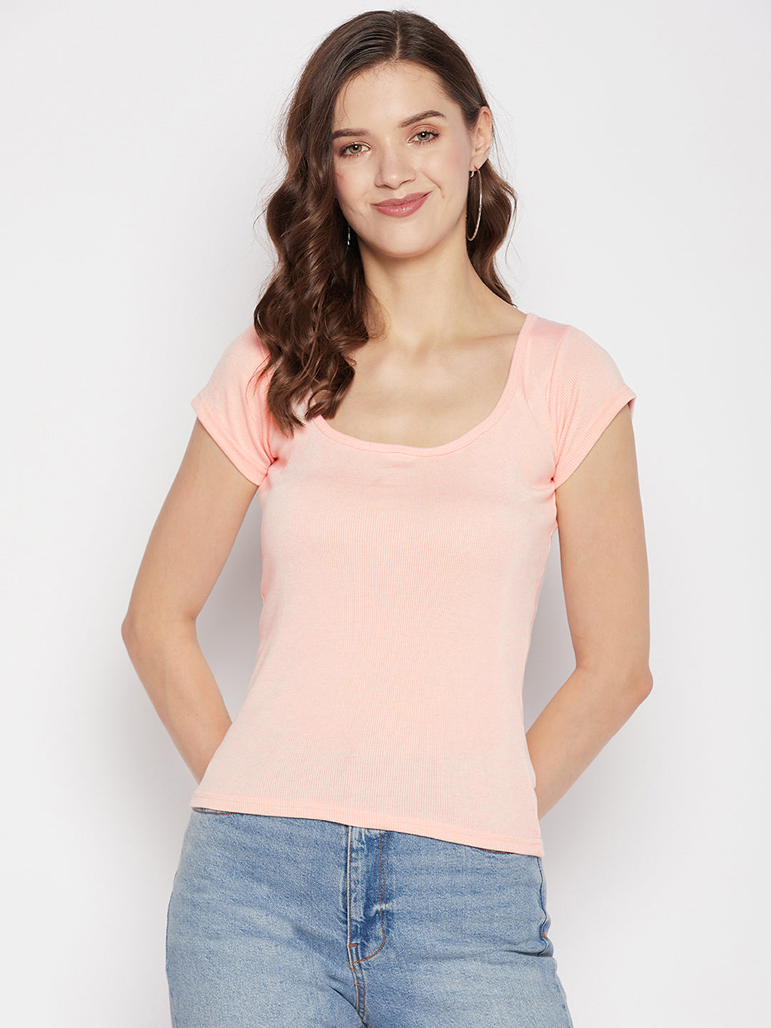 Peach solid regular fit crop top with round neck and cap sleeves.