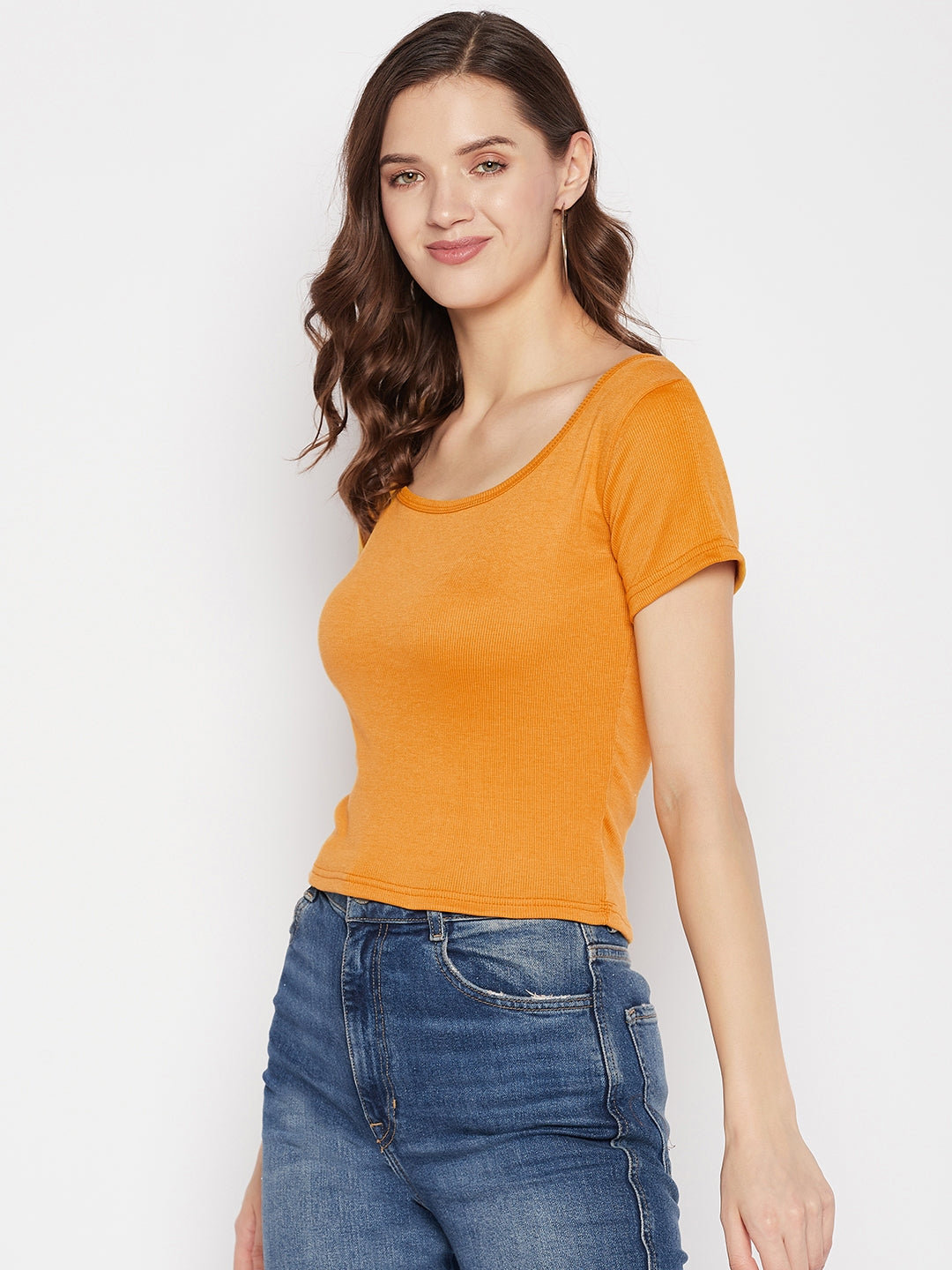 Mustard solid regular fit crop top with round neck and cap sleeves.