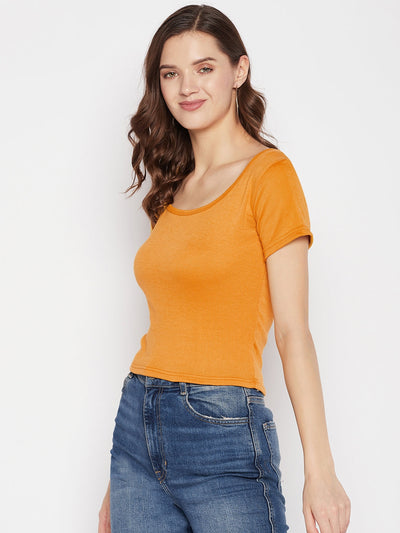 Mustard solid regular fit crop top with round neck and cap sleeves.