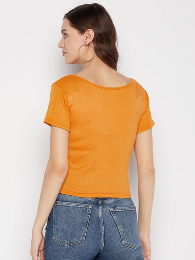 Mustard solid regular fit crop top with round neck and cap sleeves.