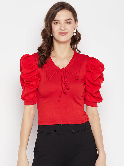 Red solid puff sleeves crop top with tie knot collar and knitted design.