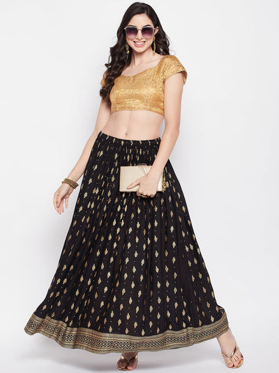 Black printed rayon maxi skirt with elasticated waistband and flared hem.