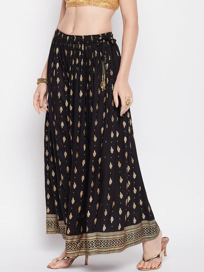 Black printed rayon maxi skirt with elasticated waistband and flared hem.