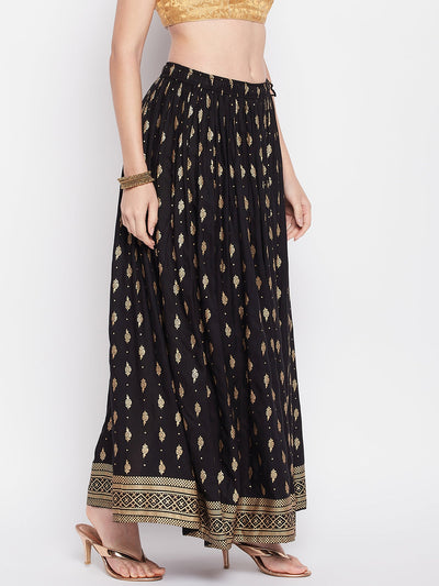 Black printed rayon maxi skirt with elastic waistband and flared hem.