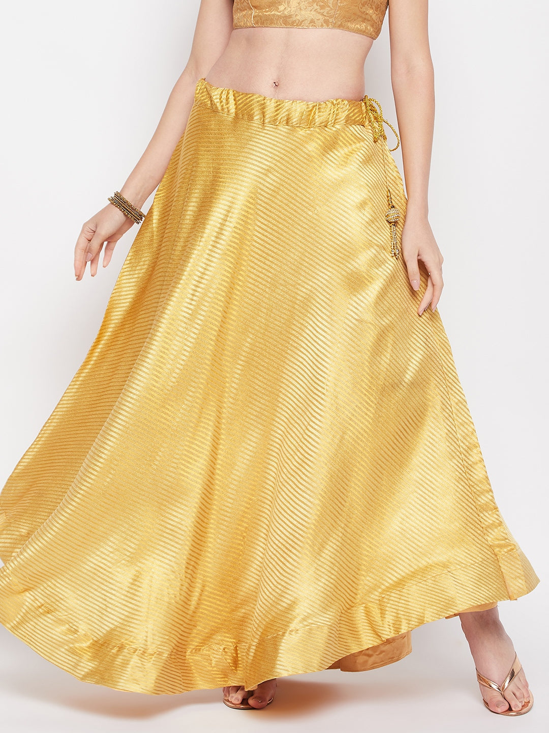 Beige striped brocade flared skirt with drawstring closure and lining.