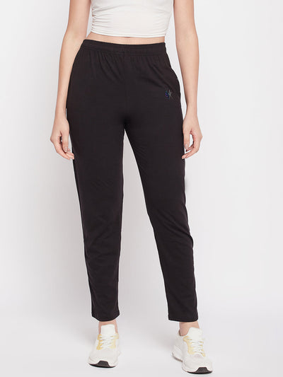 Black solid mid-rise cotton track pants with elasticated waistband and drawstring closure.