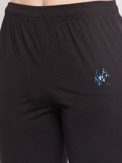 Black solid mid-rise cotton track pants with elasticated waistband and drawstring closure.