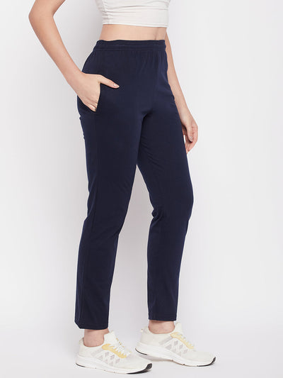 Navy blue solid mid rise cotton track pants with elasticated waistband, drawstring closure, and pockets.