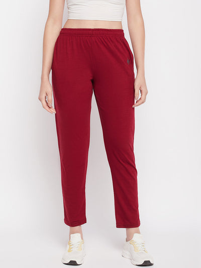 Maroon solid mid-rise cotton track pants with elastic waistband and pockets.