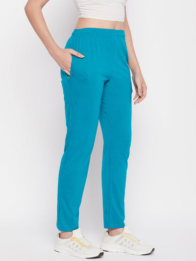 Rama Green Solid Mid Rise Cotton Track Pants with elastic waistband and pockets.
