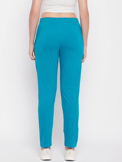 Rama Green Solid Mid Rise Cotton Track Pants with elasticated waistband and zip pocket.