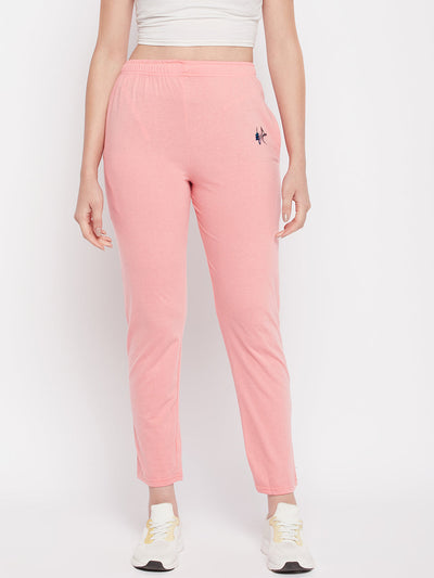 Peach solid mid rise cotton track pants with elasticated waistband and pockets.