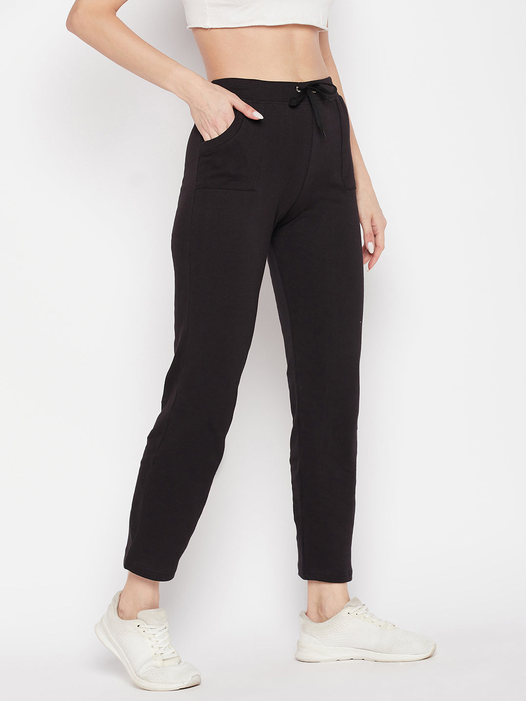 Black solid mid-rise cotton trackpants with elasticated waistband and drawstring closure.