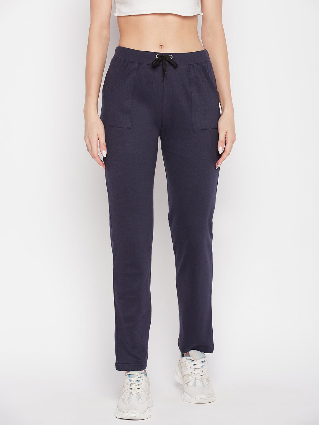 Navy blue solid mid rise cotton trackpants with elasticated waistband and drawstring closure.