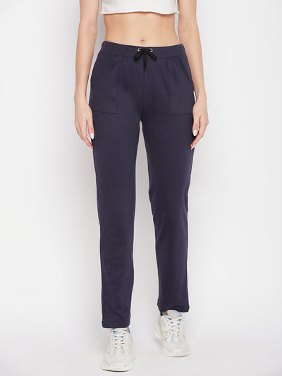 Navy blue solid mid rise cotton trackpants with elasticated waistband and drawstring closure.