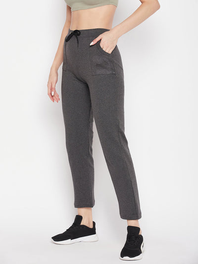 Dark grey solid mid rise cotton trackpants with elastic waistband and drawstring.