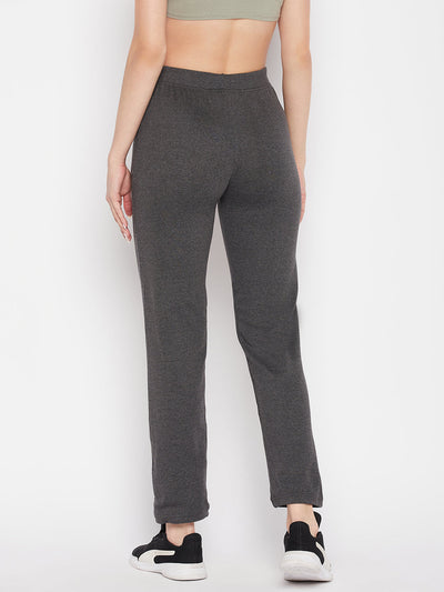 Dark grey solid mid rise cotton trackpants with elasticated waistband and drawstring closure.