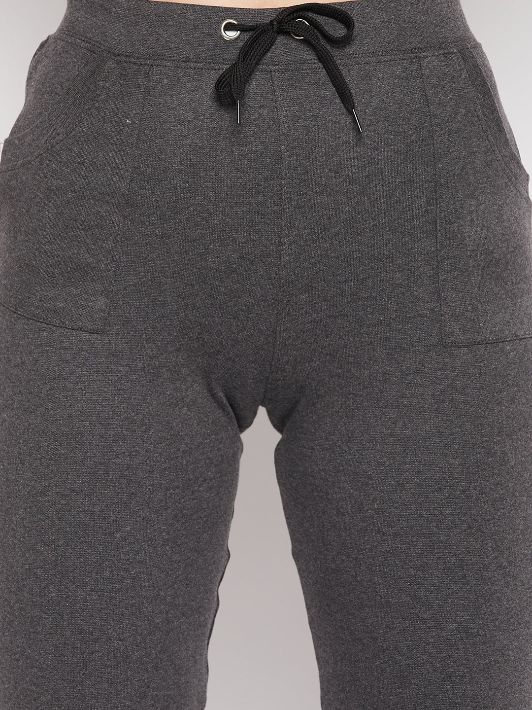 Dark grey solid mid rise cotton trackpants with elasticated waistband and drawstring closure.