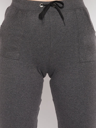 Dark grey solid mid rise cotton trackpants with elasticated waistband and drawstring closure.