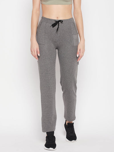 Light grey solid mid rise cotton trackpants with elasticated waistband and drawstring closure.