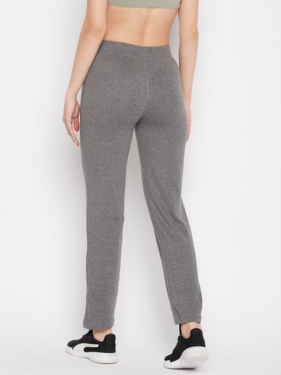 Light grey mid-rise cotton trackpants with elasticated waistband and drawstring closure.