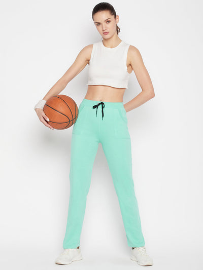 Sea green solid mid rise cotton trackpants with elasticated waistband and drawstring.