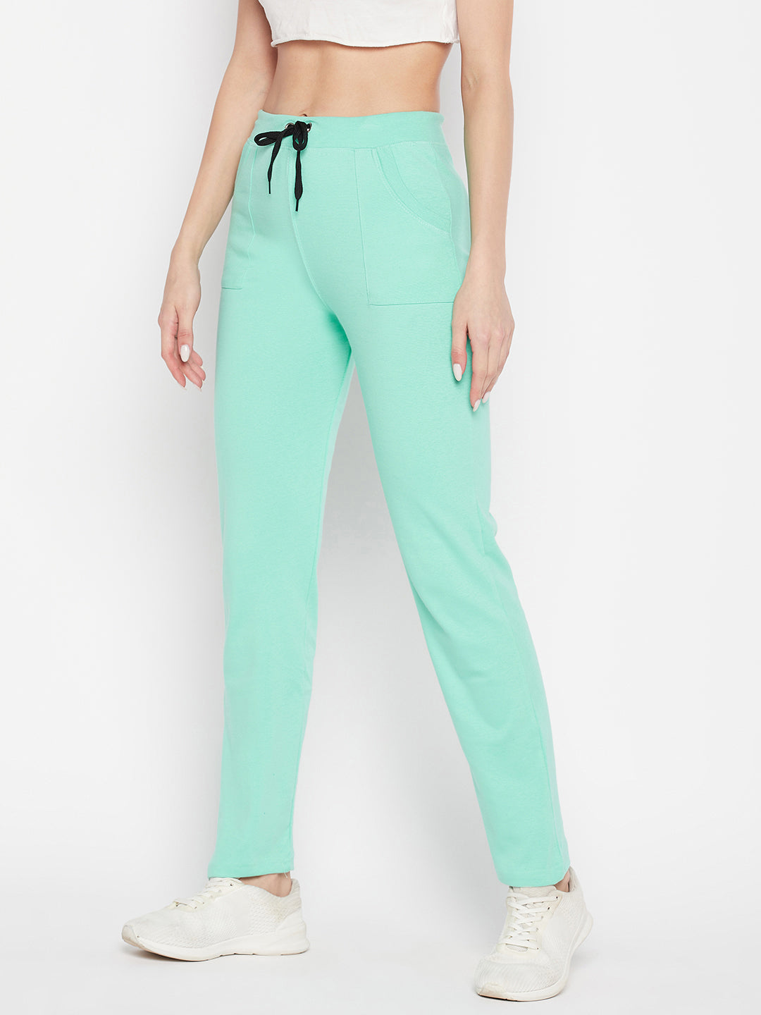 Sea green solid mid-rise cotton trackpants with elasticated waistband and drawstring.