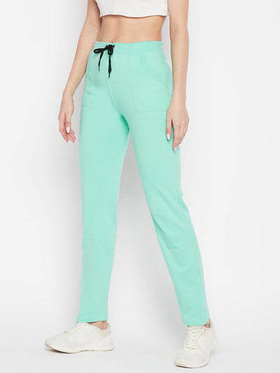 Sea green solid mid-rise cotton trackpants with elasticated waistband and drawstring.