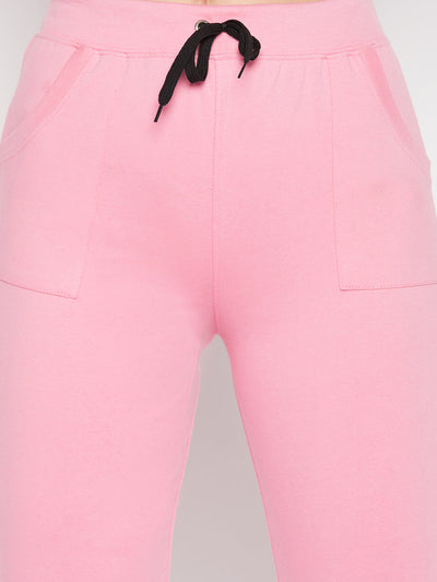 Baby pink solid mid-rise cotton trackpants with elastic waistband and drawstring.