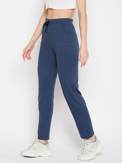 Aqua Blue solid mid-rise cotton trackpants with elastic waistband and drawstring closure.